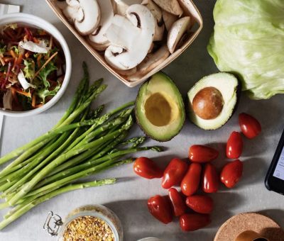 Assorted fresh vegetables and grains for a vibrant, healthy salad.